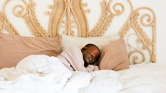 African American woman sleeping peacefully on her bed